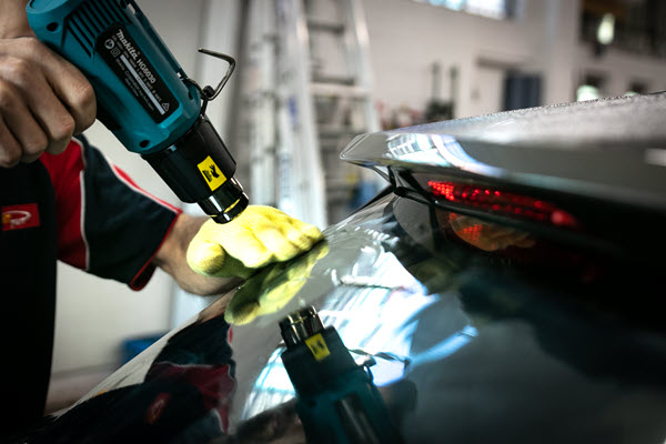 Installation of aftermarket tint to the rear window of a car